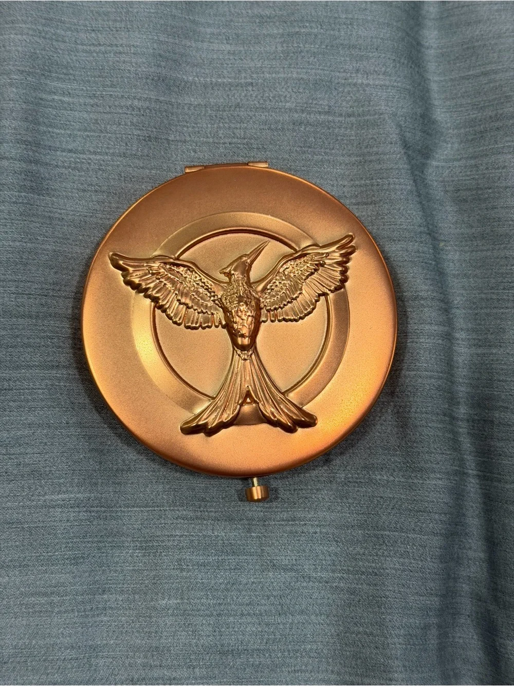 Gold Metallic Box with Embossed Bird Emblem hunger games bronzer makeup